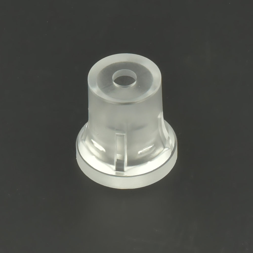 Distanțier transparent din plastic cu guler, așezat pe un fundal închis la culoare.