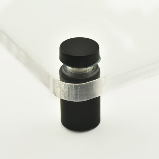 Distantier cilindric din inox de culoare gri inchis sau negru, asezat vertical.